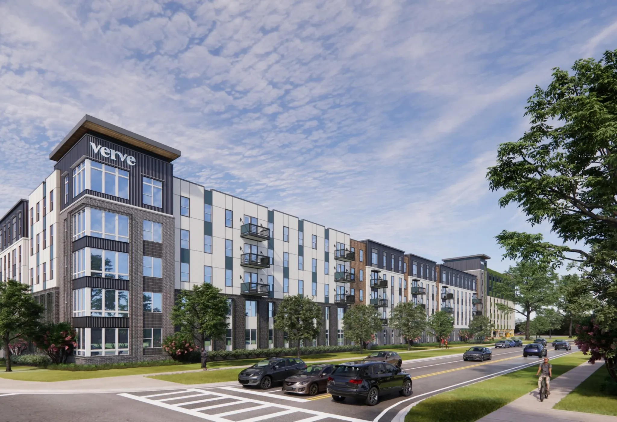 Vista de la calle de VERVE Orlando, que muestra su elegante exterior de varios pisos con líneas arquitectónicas modernas, balcones privados y vegetación circundante bajo un cielo azul brillante.